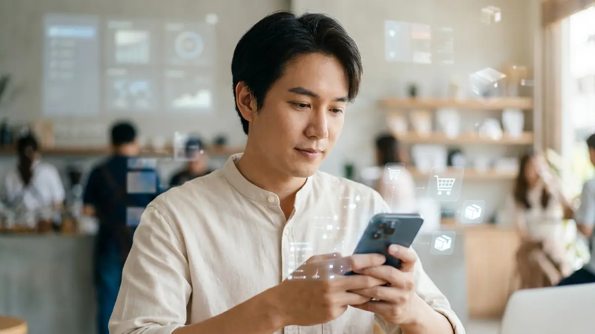 Pessoa usando smartphone para compras online, com ícones de IA e e-commerce flutuando.